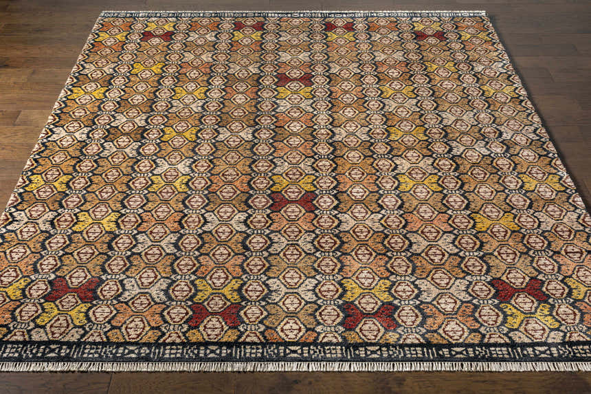Overhead view of the Mercersburg Carpet, a contemporary rug in black, red, orange, and beige with a geometric pattern. Front