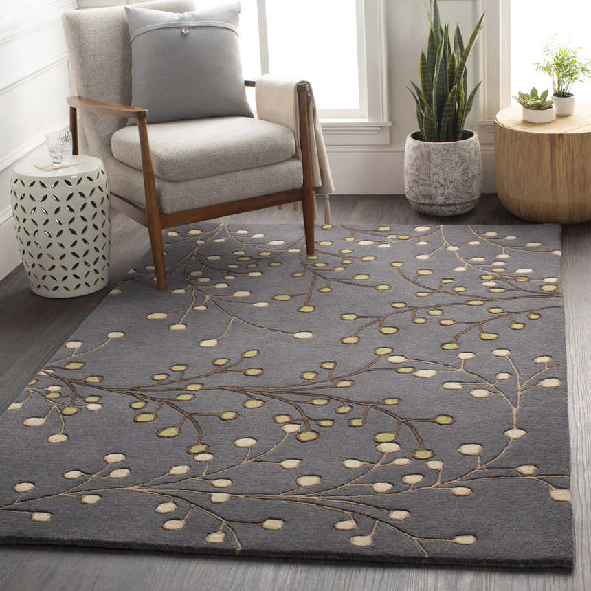 Living room scene with gray chair and Elsu Brown Beige Wool Rug featuring a floral branch design. Roomscene-Rectangle