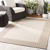 Beige Muncie Area Rug in an outdoor living space with wicker furniture and potted plants. Contemporary farmhouse style. Roomscene-Rectangle