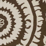 Close up of the hand woven Naeva Area Rug featuring a dark brown and walnut contemporary floral pattern. Swatch