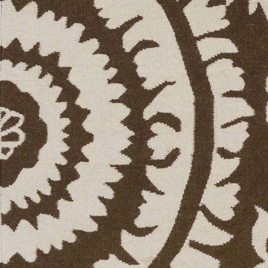 Close up of the hand woven Naeva Area Rug featuring a dark brown and walnut contemporary floral pattern. Swatch