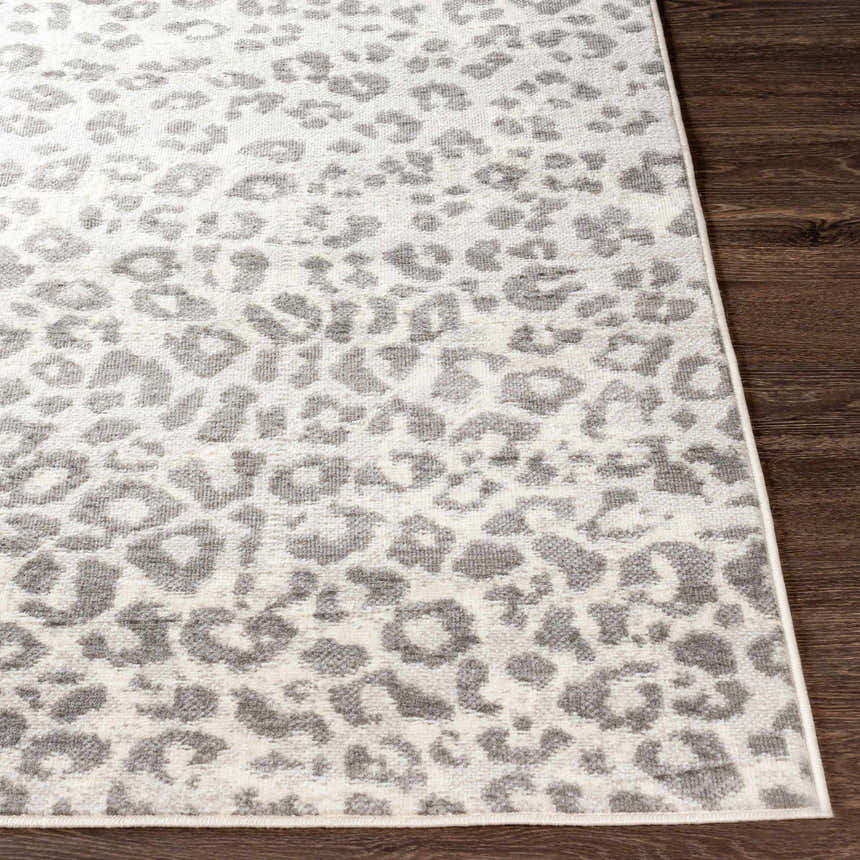 Close-up of the Nagambie Leopard Print Area Rug showing its gray animal pattern and soft, textured pile. Front