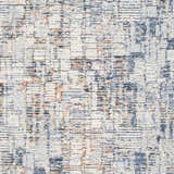 Close-up of Nalus Area Rug showing a cream base with brick red, denim, and gray abstract pattern. Swatch