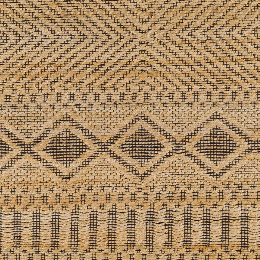 Close-up of the Nasugbu Jute Carpet. Tan jute rug with a black geometric pattern. Hand woven texture. Swatch