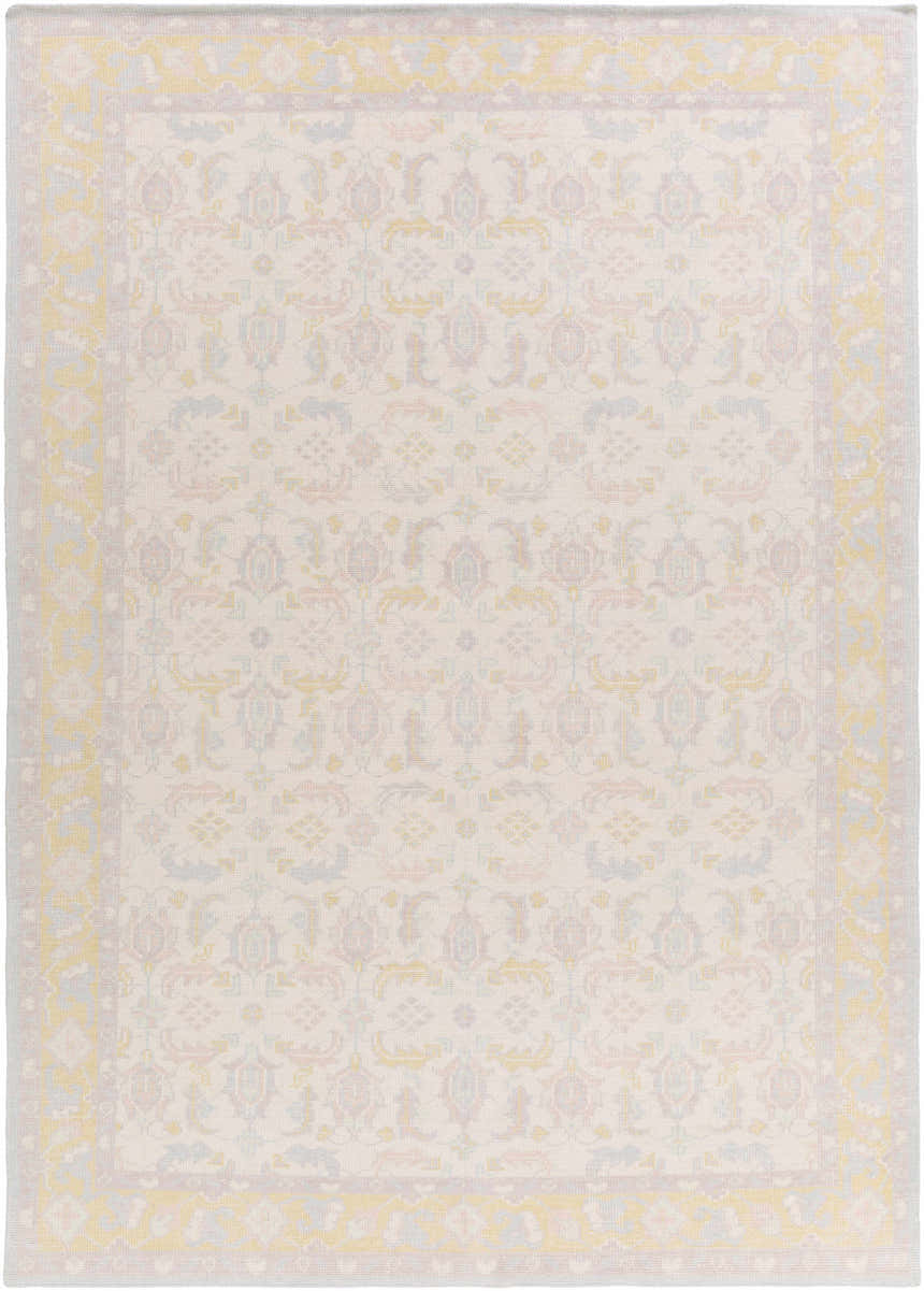 Close-up of the Navarino Area Rug. Hand-knotted wool rug in light beige with denim, dusty pink, and mustard traditional pattern. Design-Rectangle-811