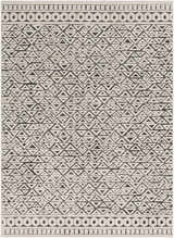 Close-up of the Naylor Beige/Charcoal Rug. Features a geometric triangle pattern and circle border design. Farmhouse style. Design-Rectangle-5373