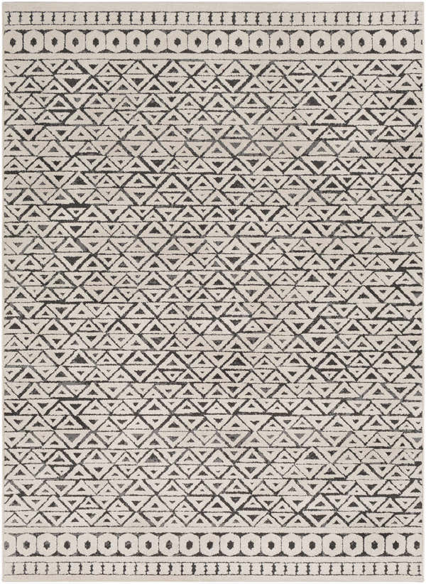 Close-up of the Naylor Beige/Charcoal Rug. Features a geometric triangle pattern and circle border design. Farmhouse style. Design-Rectangle-5373