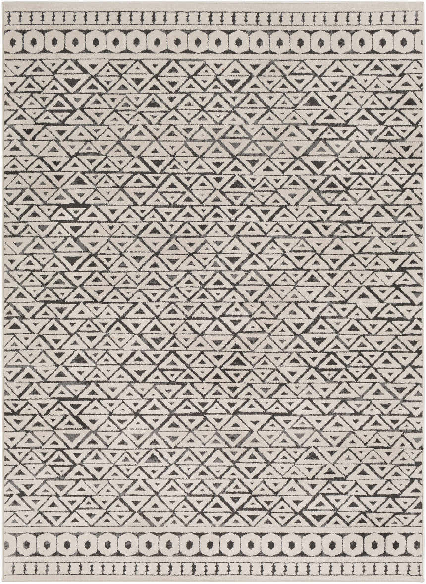 Close-up of the Naylor Beige/Charcoal Rug. Features a geometric triangle pattern and circle border design. Farmhouse style. Design-Rectangle-5373