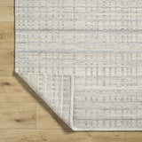 Close-up of the hand-woven Nissa Tan Area Rug showing ivory and tan colors, horizontal stripes, and wool texture. Fold