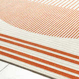 Close up of the Nabil Cream Area Rug showing the cream and orange striped contemporary design. Texture