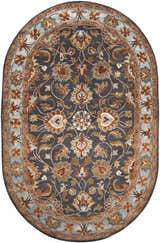 Close-up of oval Cherryfield 1004 rug. Hand-tufted wool rug with floral pattern in beige, burnt orange, and slate blue on charcoal. Design-Oval-69
