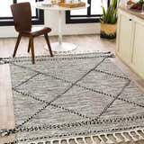 Kitchen scene with Neal Black/Cream Trellis Cotton Rug, white table, wood chair, and light wood cabinets. Roomscene-Rectangle