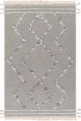 Close-up of the Needville Gray High-Low Rug. Hand-woven rug with diamond pattern, fringe, and tassels. Farmhouse style. Design-Rectangle-576