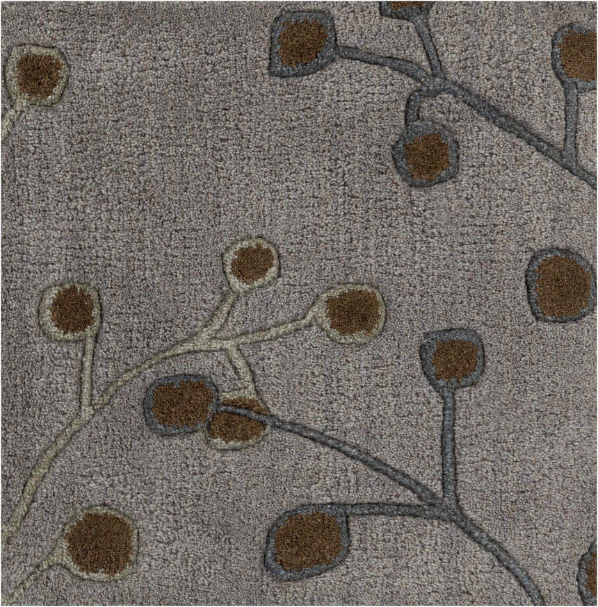 Close-up of the Sage Brown Elsu Area Rug showing the floral design, brown accents, and soft, textured wool. Swatch