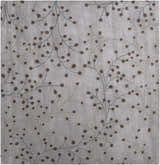 Close-up of Sage Brown Elsu Area Rug with a floral design in dark brown and dusty sage colors. Hand-tufted wool texture. Design-Square-8