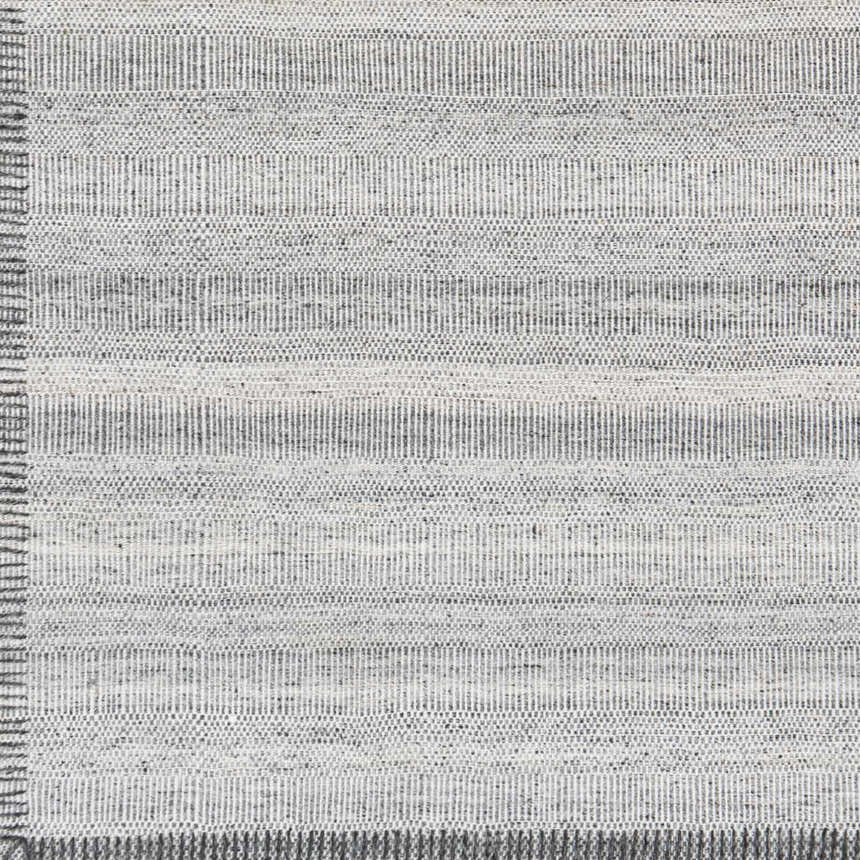 Close-up of the Nettleham Silver Viscose Rug showing its charcoal, medium gray, and silver gray woven texture. Swatch
