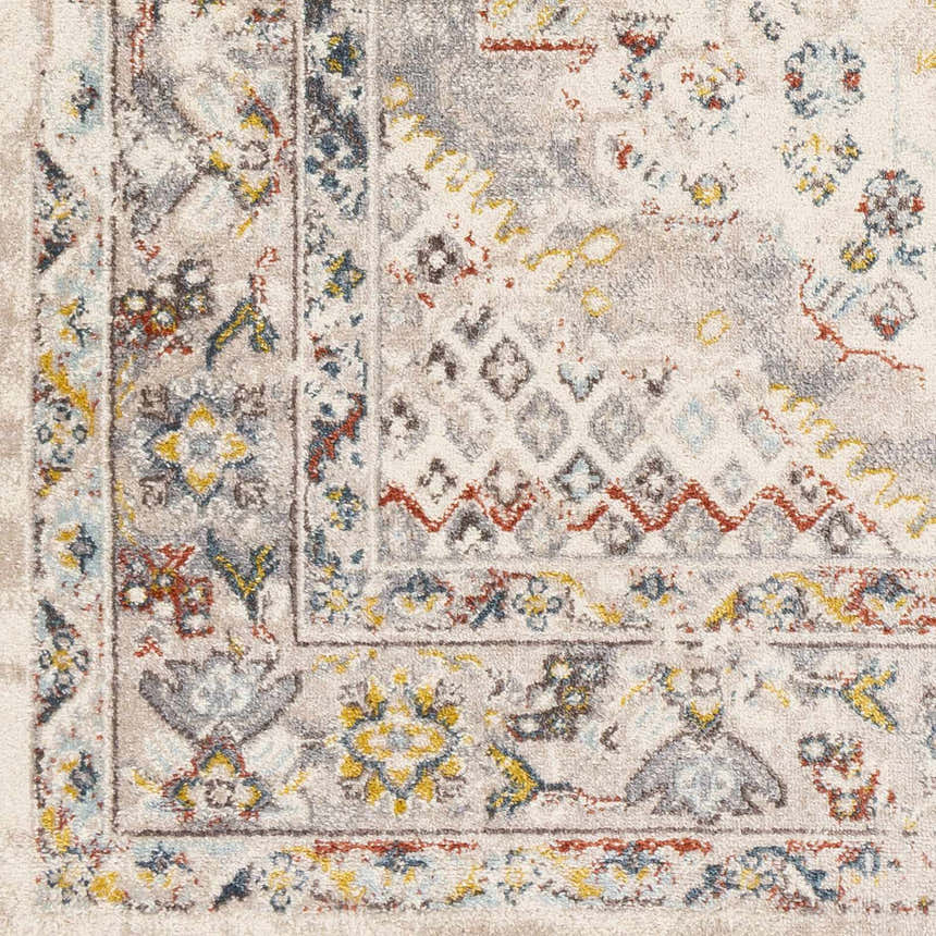 Close-up of the Newkirk Area Rug. Traditional rug pattern in cream, charcoal, brick red, blue, and mustard. Swatch