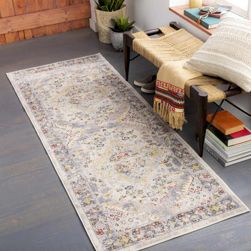 Entryway with a Newkirk Area Rug runner, woven bench, plants, and gray wood floors. Roomscene-Runner
