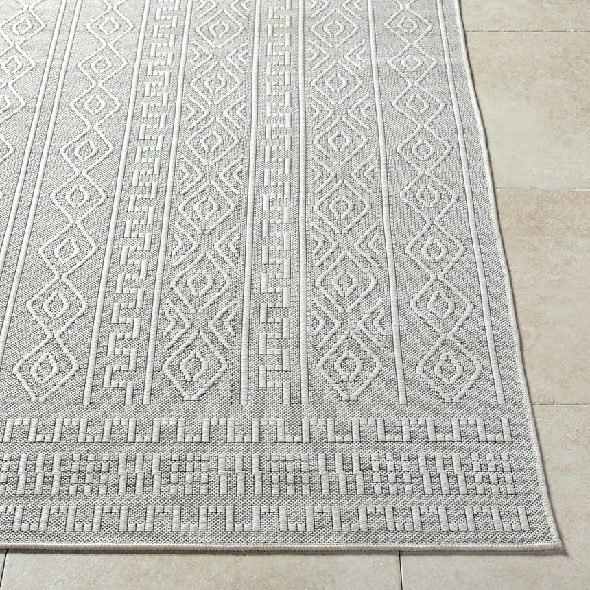 Close-up of the Nuela Light Gray Area Rug showing diamond and geometric patterns, and woven texture. Front