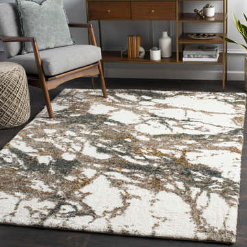 Living room scene with Ngunnawal Cream/Brown Marble Plush Rug, gray chair, wood console, and dark wood floors. Roomscene-Rectangle