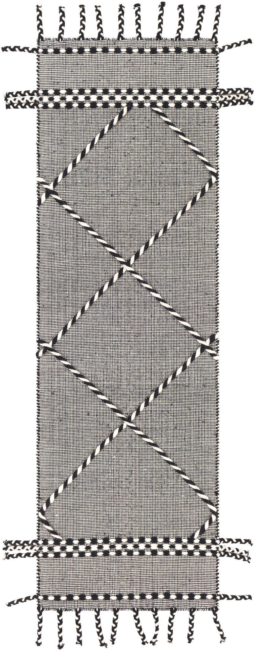 Close-up of the hand woven Ninderry Wool Area Rug; black and cream rug with a geometric pattern and braided fringe. Design-Runner-268
