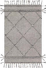 Close-up of the hand woven Ninderry Wool Area Rug. Black and cream rug with diamond pattern and tassels. Bohemian style. Design-Rectangle-576