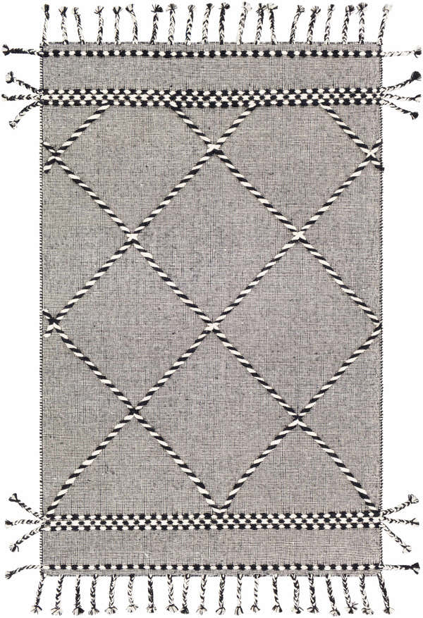 Close-up of the hand woven Ninderry Wool Area Rug. Black and cream rug with diamond pattern and tassels. Bohemian style. Design-Rectangle-576