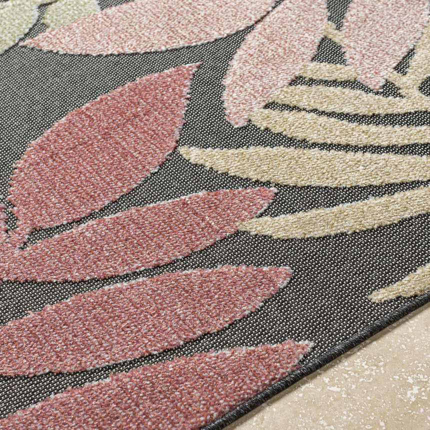 Close up of Nasha Charcoal Area Rug showing dusty pink and beige leaf pattern on charcoal background. Texture