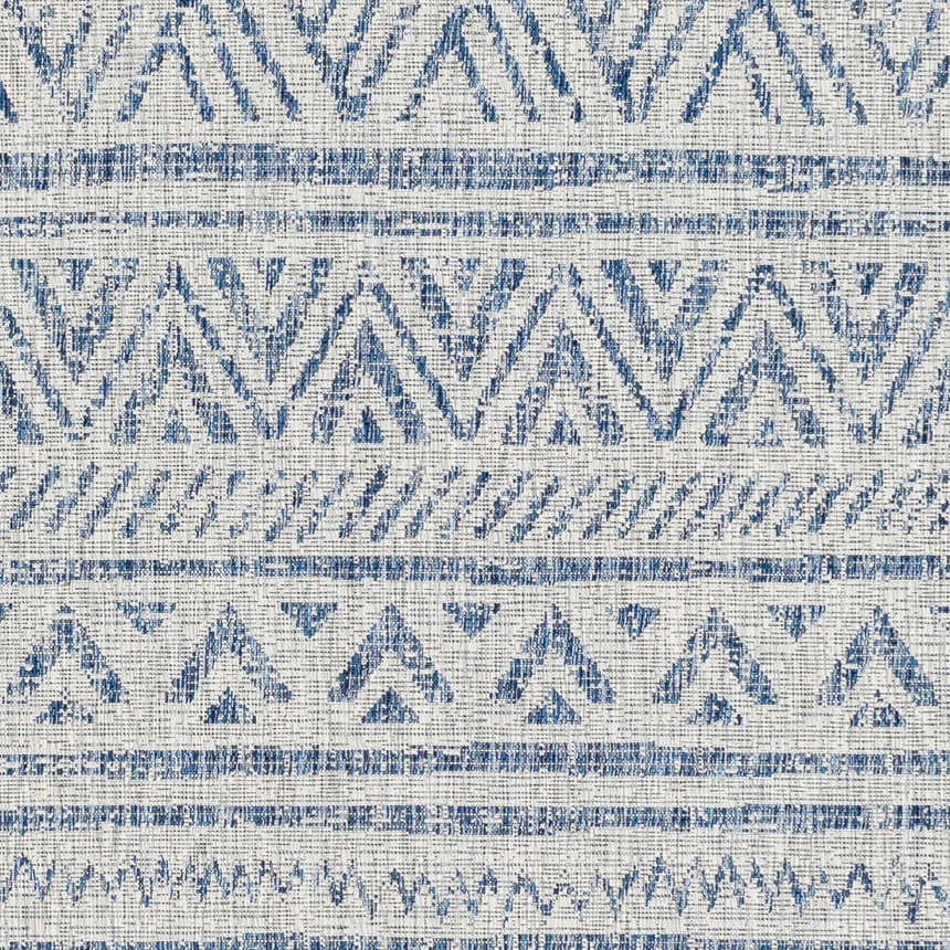Close-up of Novato All Over Pattern Performance Rug. Blue, ink blue, and taupe geometric design. Swatch