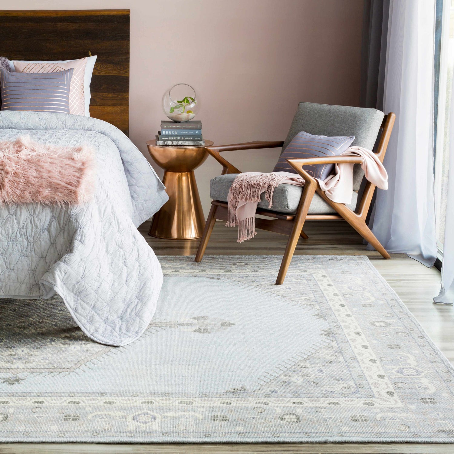 Bedroom scene with a light blue Northstowe Carpet, gray chair, wood accents, and soft pink details. Calming, farmhouse style. Roomscene-Rectangle