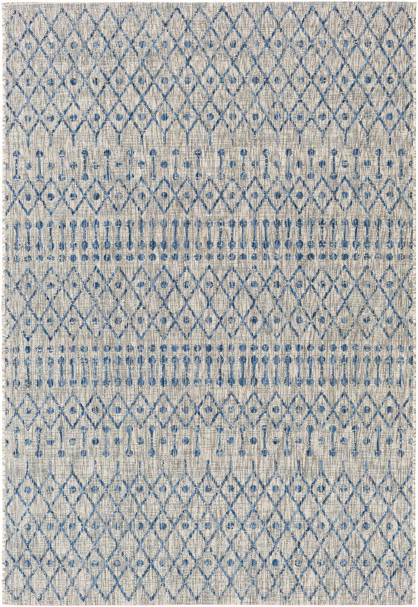 Close-up of Newbern Outdoor Rug. Blue diamond pattern on a textured taupe and white background. Design-Rectangle-5376