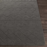Close-up of the charcoal Newtonhill Clearance Rug. Hand-loomed wool rug with geometric farmhouse pattern. Front
