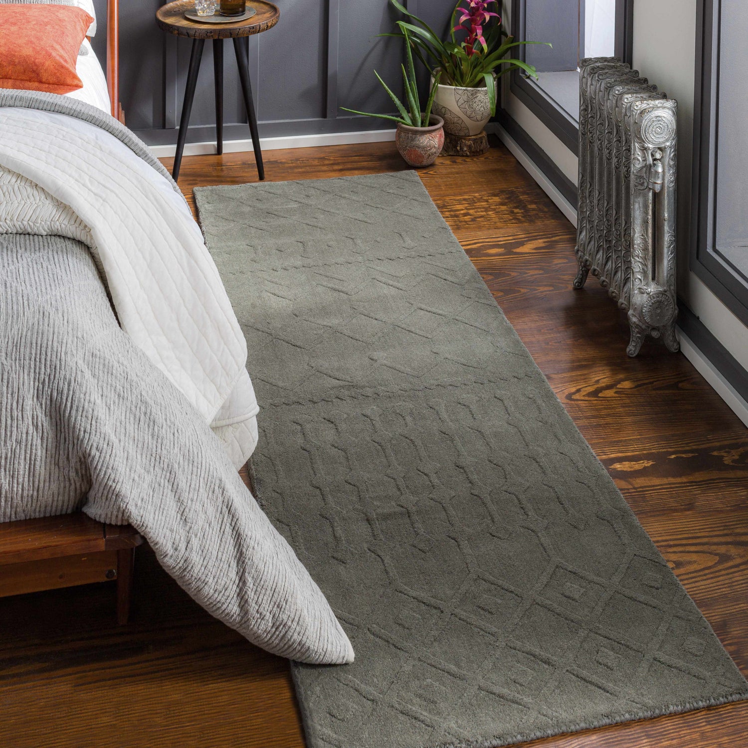 Bedroom scene with a charcoal Newtonhill Clearance Rug, wood floors, and a farmhouse style. Roomscene-Runner