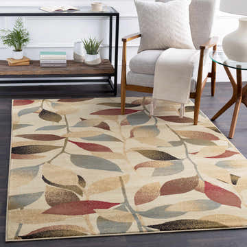 Living room scene with a beige Ober Fall Leaves Rug featuring a red, brown, and green leaf pattern. Roomscene-Rectangle