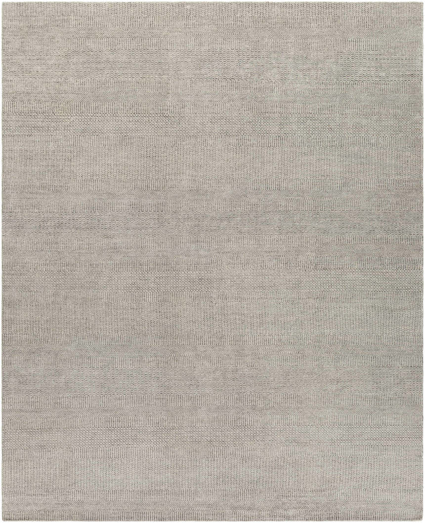 Close-up of the hand-knotted Ocate Gray Wool Area Rug, featuring charcoal, gray, and light gray tones. Contemporary style. Design-Rectangle-810