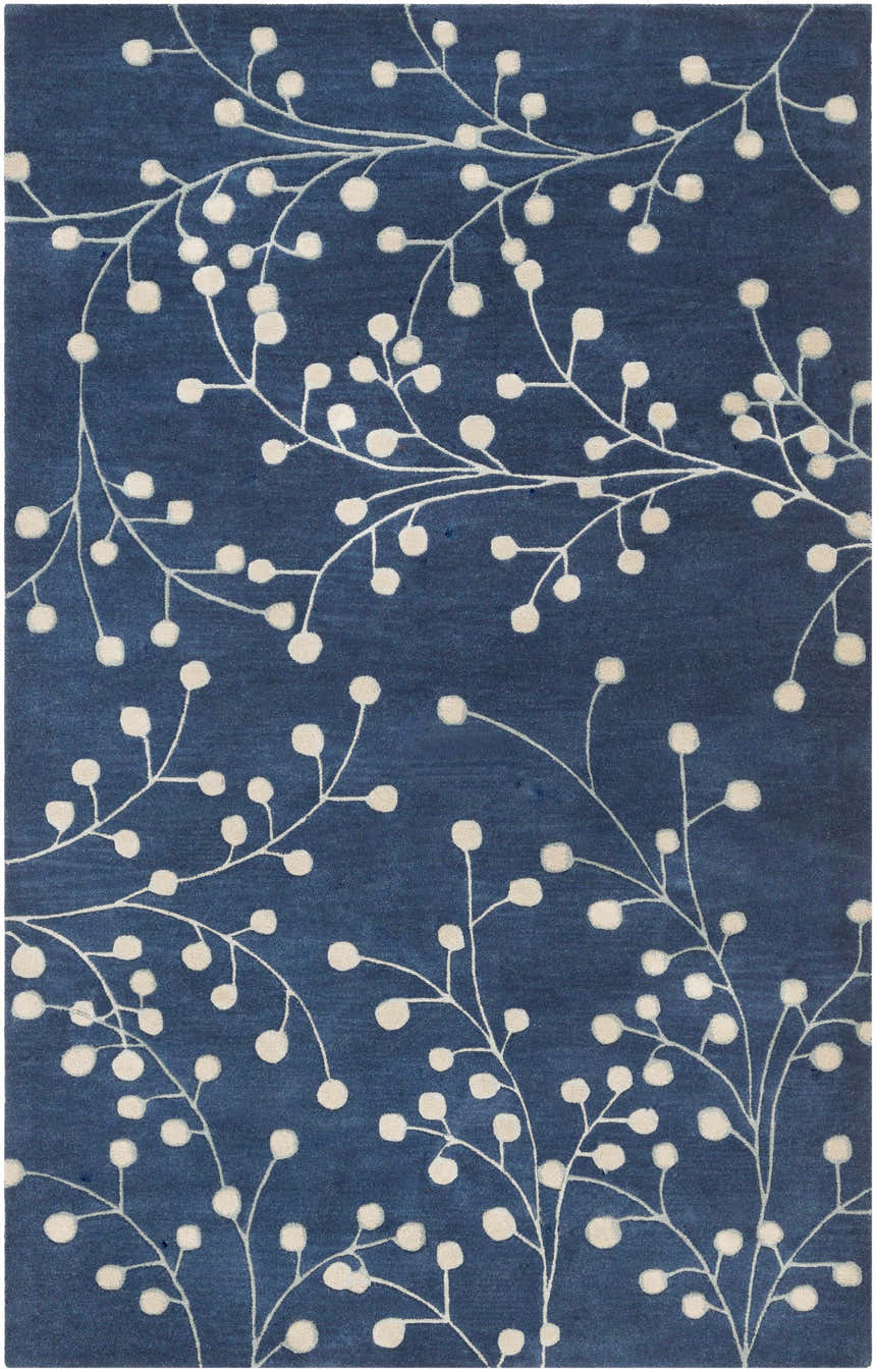 Close-up of the Blue Elsu Area Rug featuring a botanical design with ink blue background and ivory floral pattern. Design-Rectangle-58