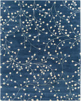 Close-up of the Blue Elsu Area Rug featuring a tan floral vine pattern on an ink blue wool background. Design-Rectangle-7696