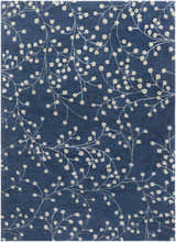 Close-up of the Blue Elsu Area Rug featuring a tan floral pattern on an ink blue wool background. Design-Rectangle-811