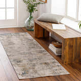 Entryway with wood bench and Odell Abstract Luxe Fringe Rug in dark blue, light blue, gray, and mustard. Roomscene-Runner