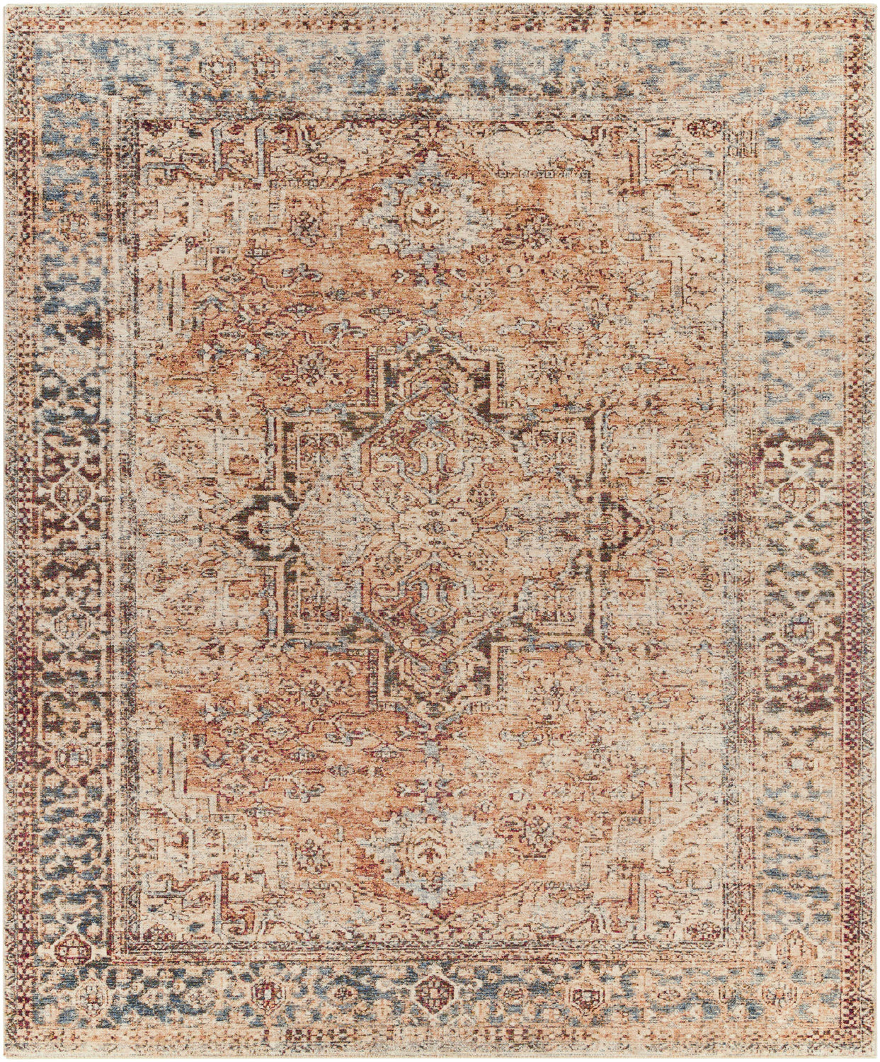Close-up of the Onley Area Rug. Machine-woven polyester rug with a vintage bohemian pattern in denim, gold, and beige. Design-Rectangle-810