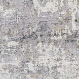 Close-up of the Ooralea Area Rug showing its charcoal, dark blue, beige, and gray contemporary abstract pattern. Swatch