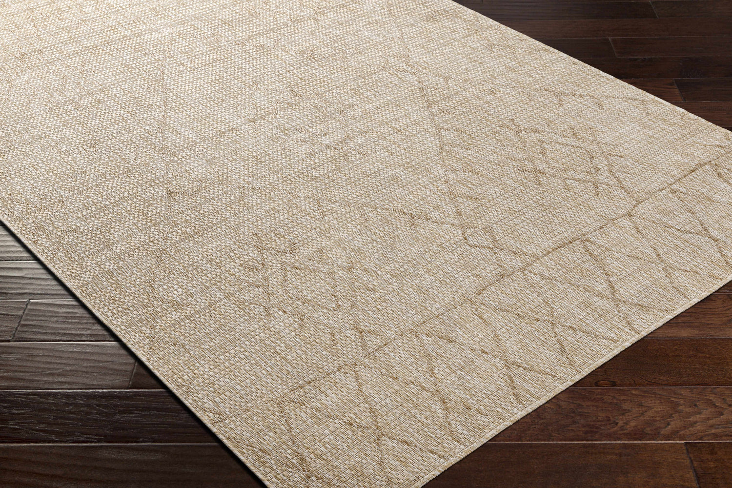 Close-up of the Marwood Brown Nordic Rug showing the woven texture and subtle geometric pattern on dark wood floors. Corner
