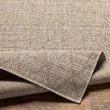 Close-up of the woven texture and backing of the Marwood Brown Nordic Rug. Neutral tones, durable polypropylene material. Fold