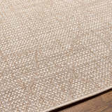Close-up of the Marwood Brown Nordic Rug showing its woven texture and subtle geometric pattern in cream and light brown. Texture