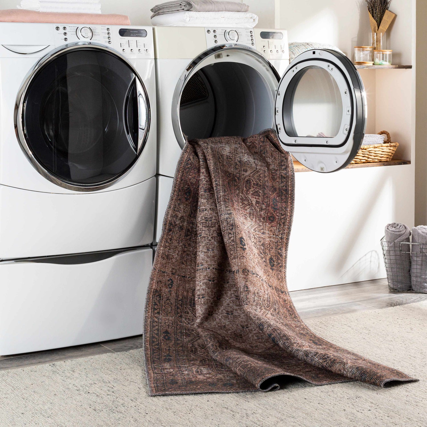 Tan Ormstown Distressed Washable Area Rug in a laundry room, fresh from the dryer. Easy care rug. Washing-Machine