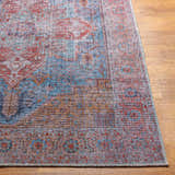 Close-up of the Otaki Washable Area Rug with a traditional oriental pattern in dark gray, brown, red, and blue tones. Front