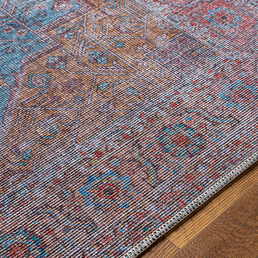 Close-up of the Otaki Washable Area Rug showing its traditional, multi-colored pattern and chenille-polyester/cotton texture. Texture