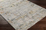 Close-up of the Ottawa Luxe Rug showing its cream, gray, teal, and brick red contemporary Persian design and soft texture. Corner