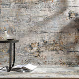Styled Ottawa Luxe Rug in a room scene with a side table, books, vase, and neutral wall. Styleshot