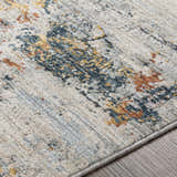 Close-up of the Ottawa Luxe Rug showing its cream, blue, tan, and gray contemporary Persian design. Texture